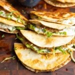 paratha tacos on a serving platter with raita