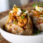 baked potatoes topped with the chili garlic beans