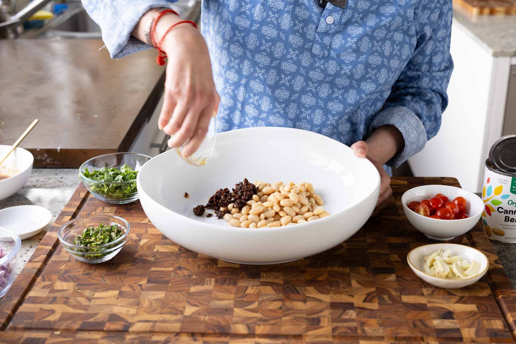 adding beans to the bowl