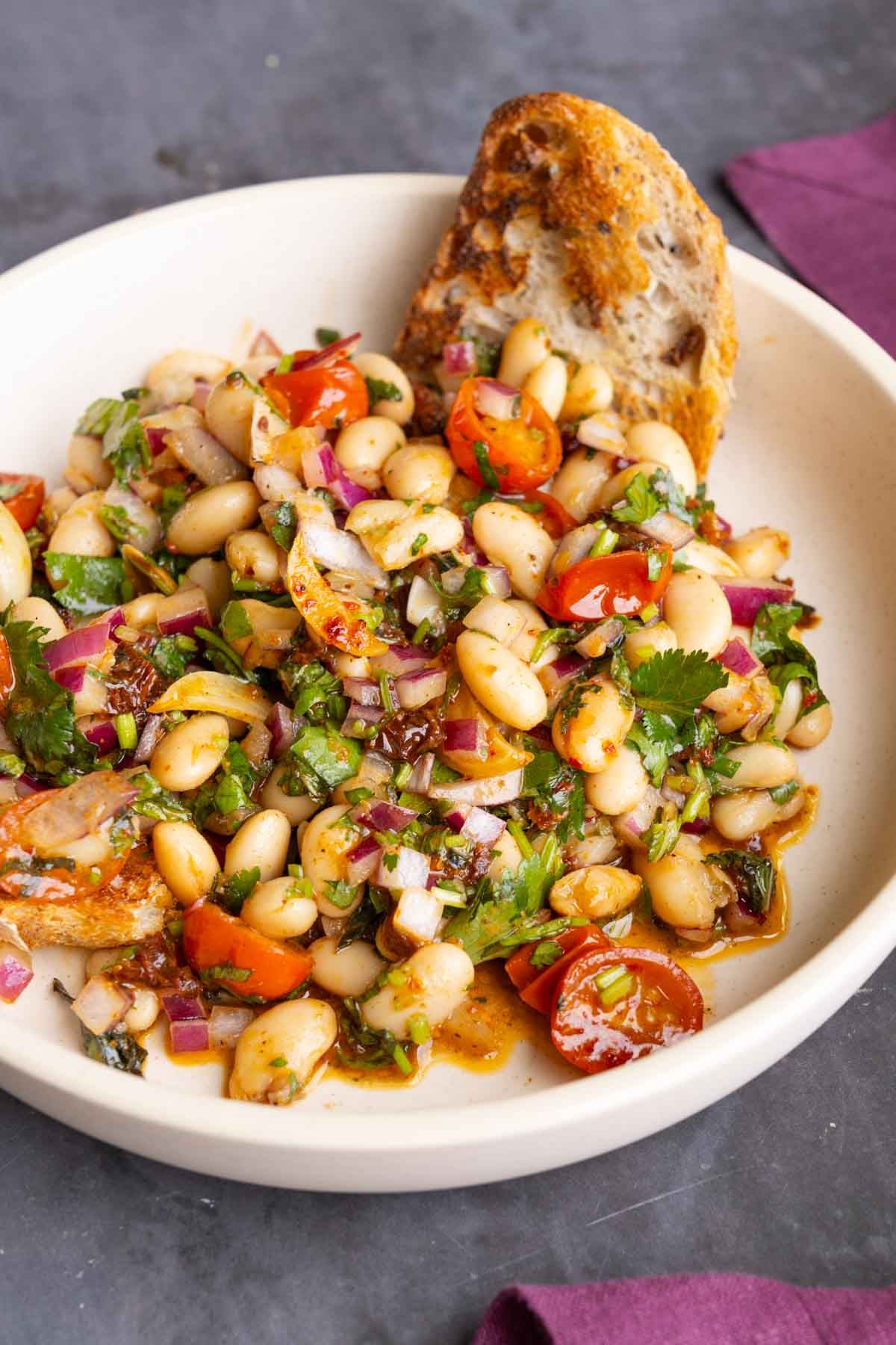 marinated white bean salad with bread to dip