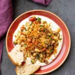 marinated white bean salad served over hummus with bread
