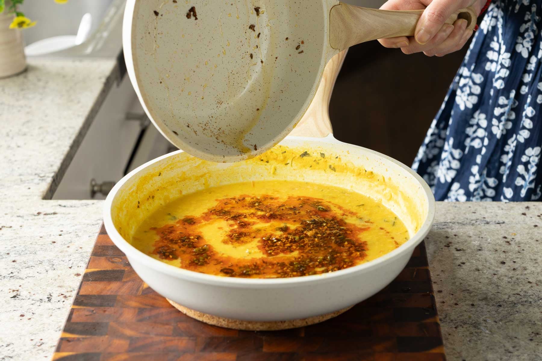 swirling the cumin tadka over the dal
