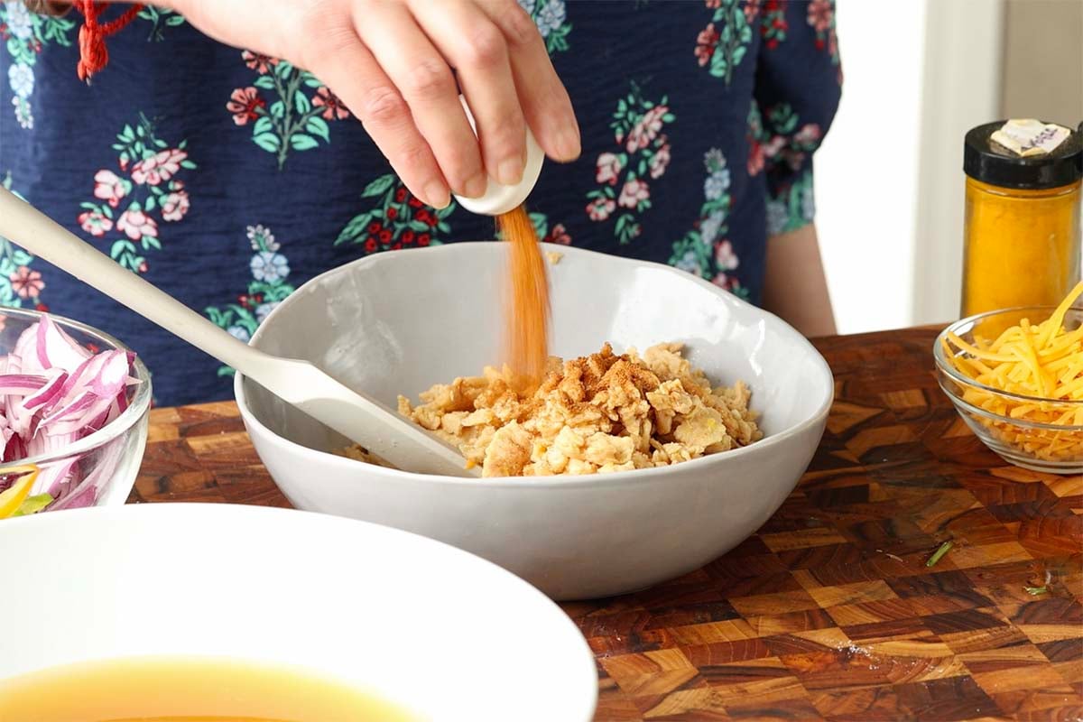 adding seasonings to the soy curls