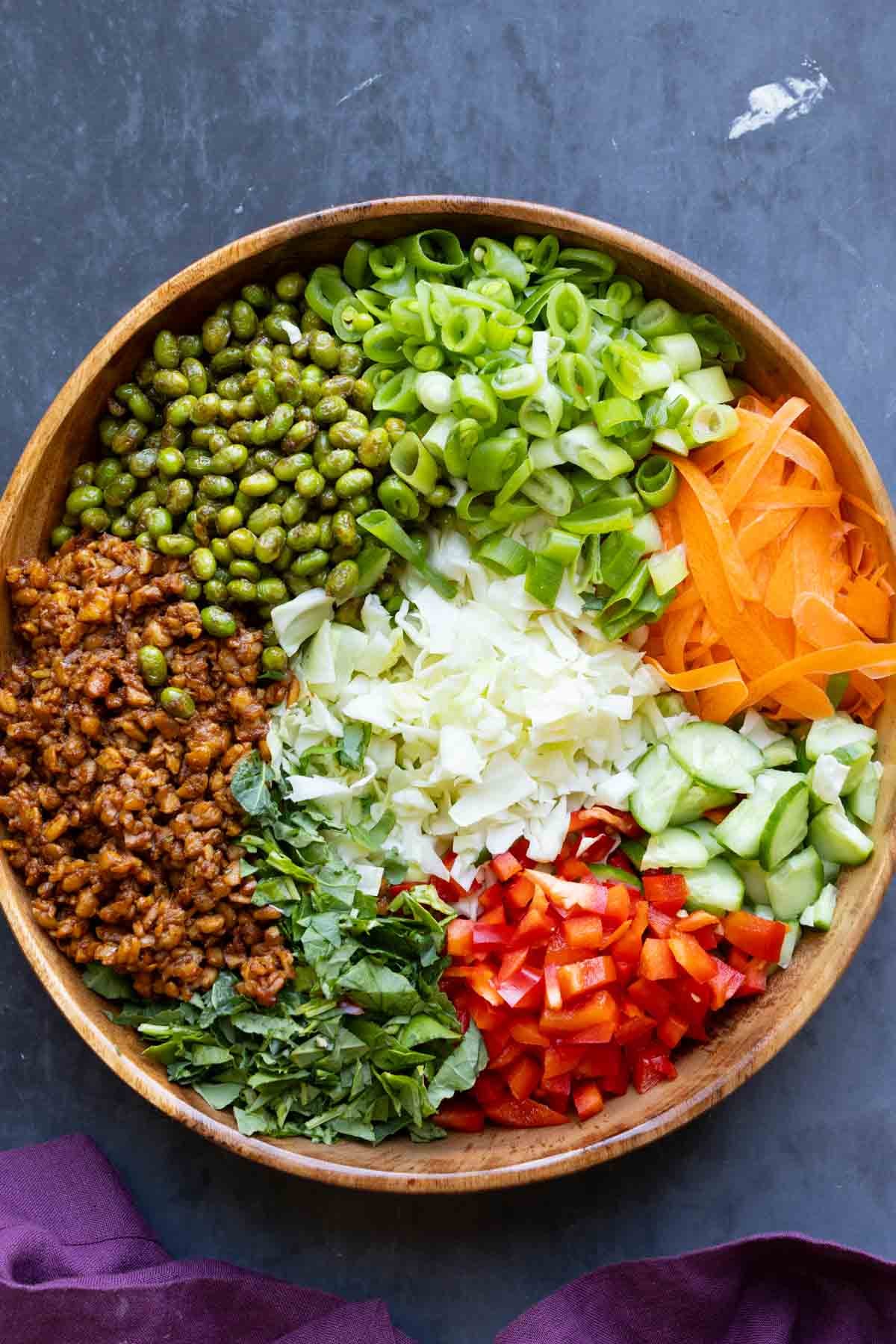 gochujang salad ingredients in a bowl before mixing