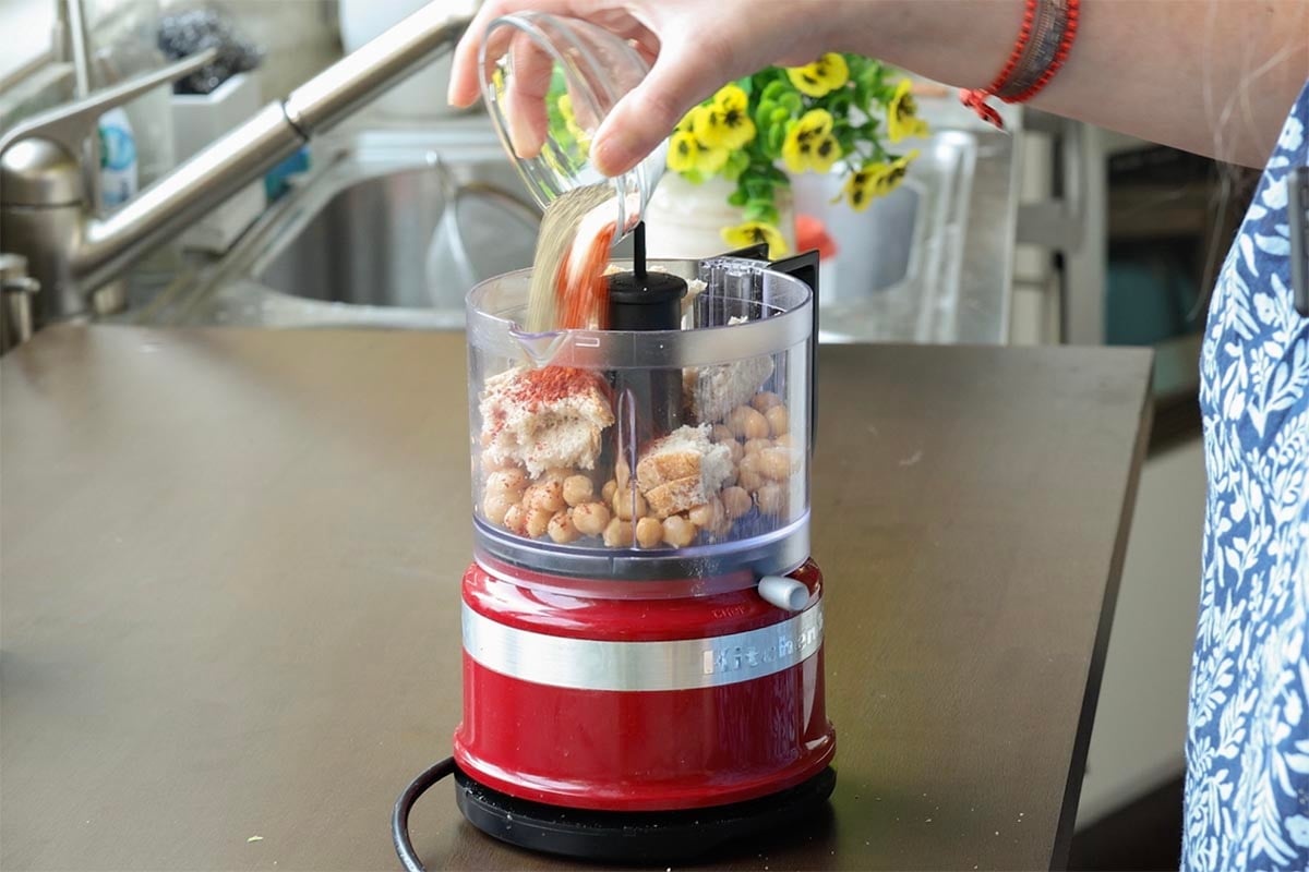 chickpea topping ingredients in the food processor before running it