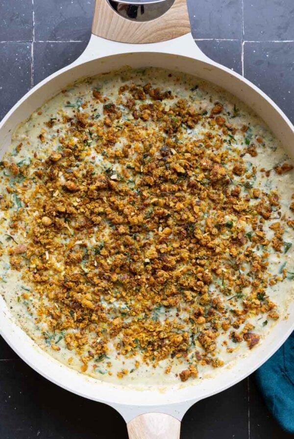 pepper beans in the pan after adding the topping