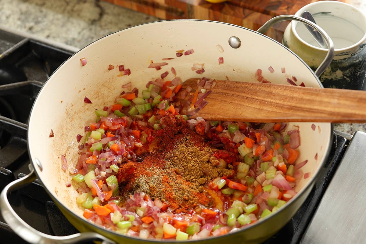 adding spices to the pan