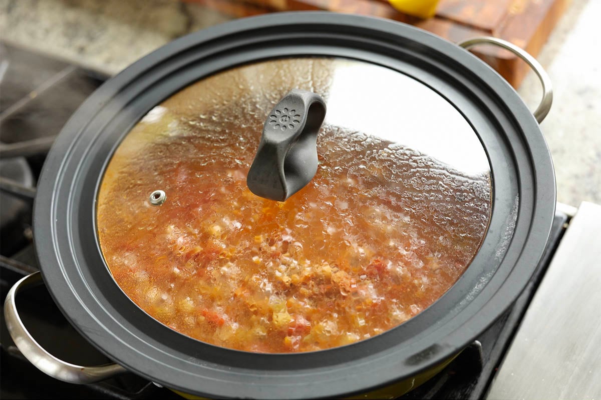 covered pan simmering on the stove