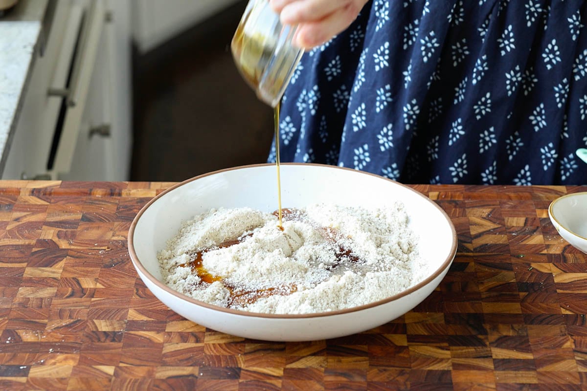 adding wet ingredients to the dry