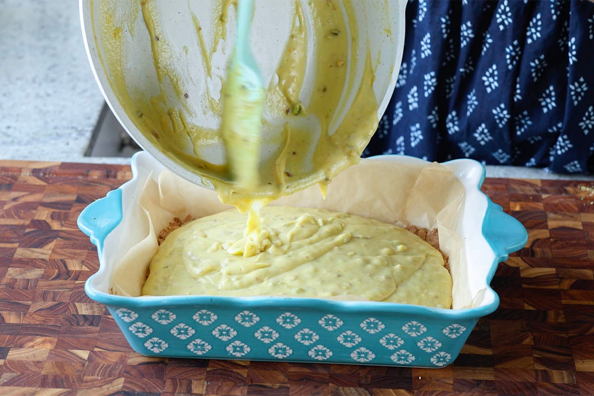 pouring saffron cream over the crust