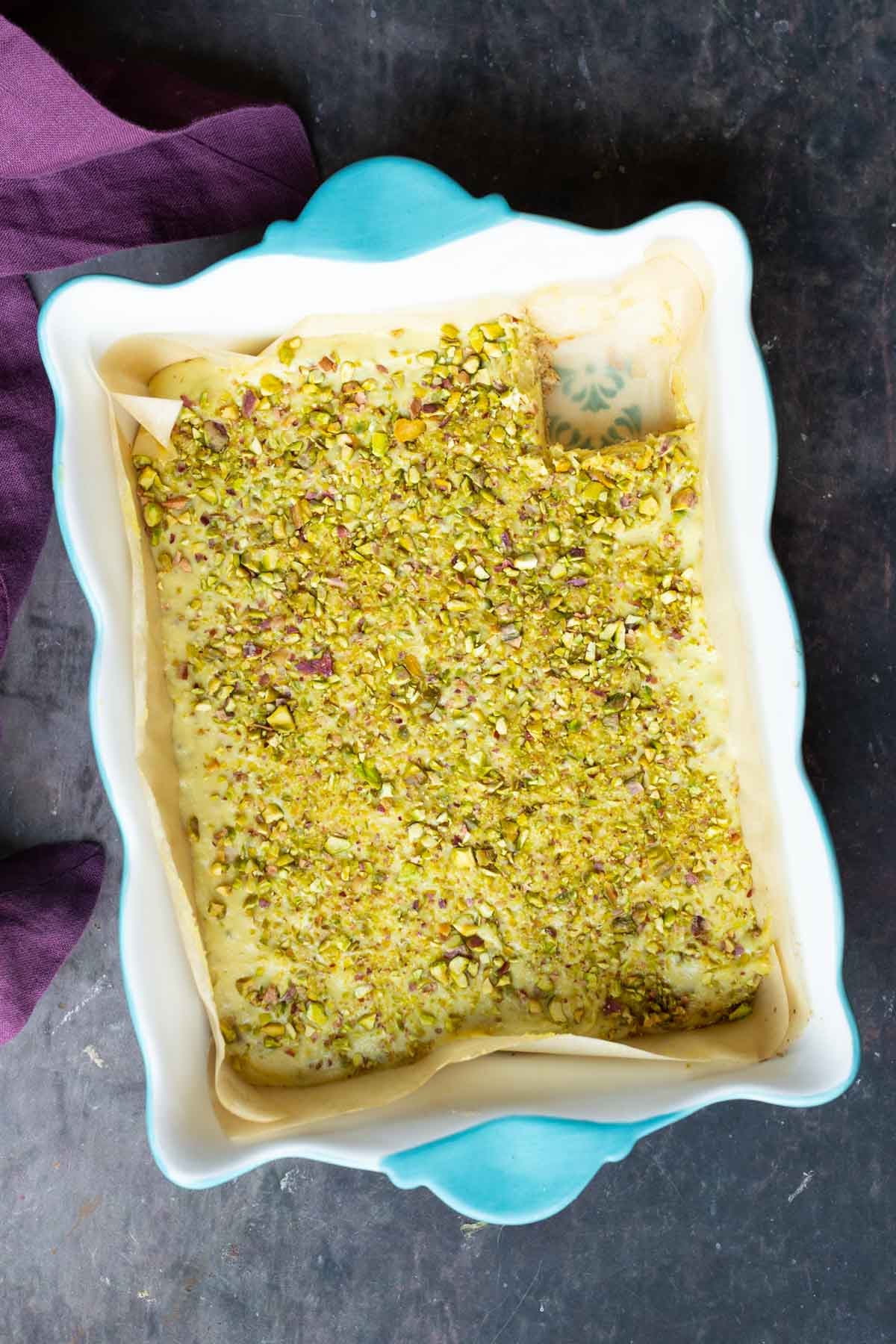 saffron pistachio bars in the pan after chilling