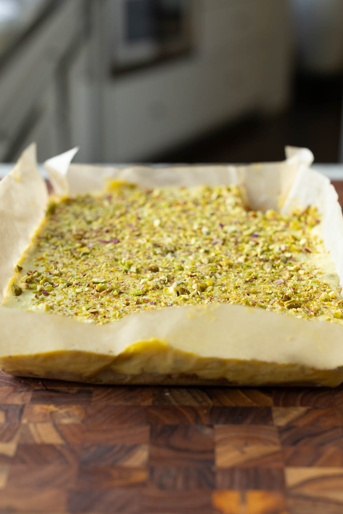 kesar pista bars on the cutting board before slicing
