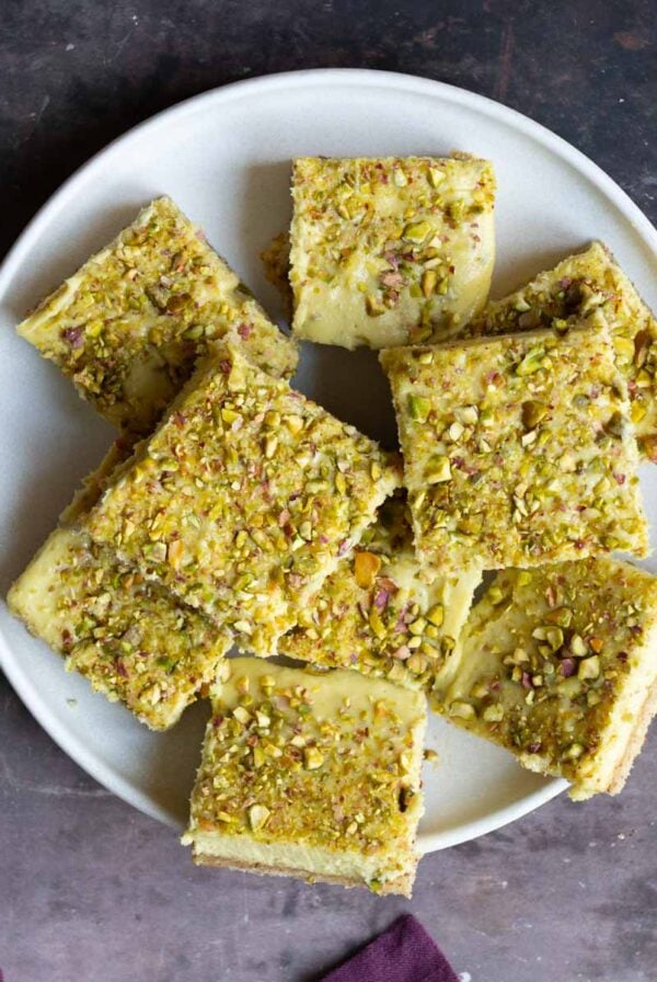 sliced saffron pistachio bars on a white plate
