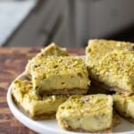 sliced saffron pistachio bars on a white plate