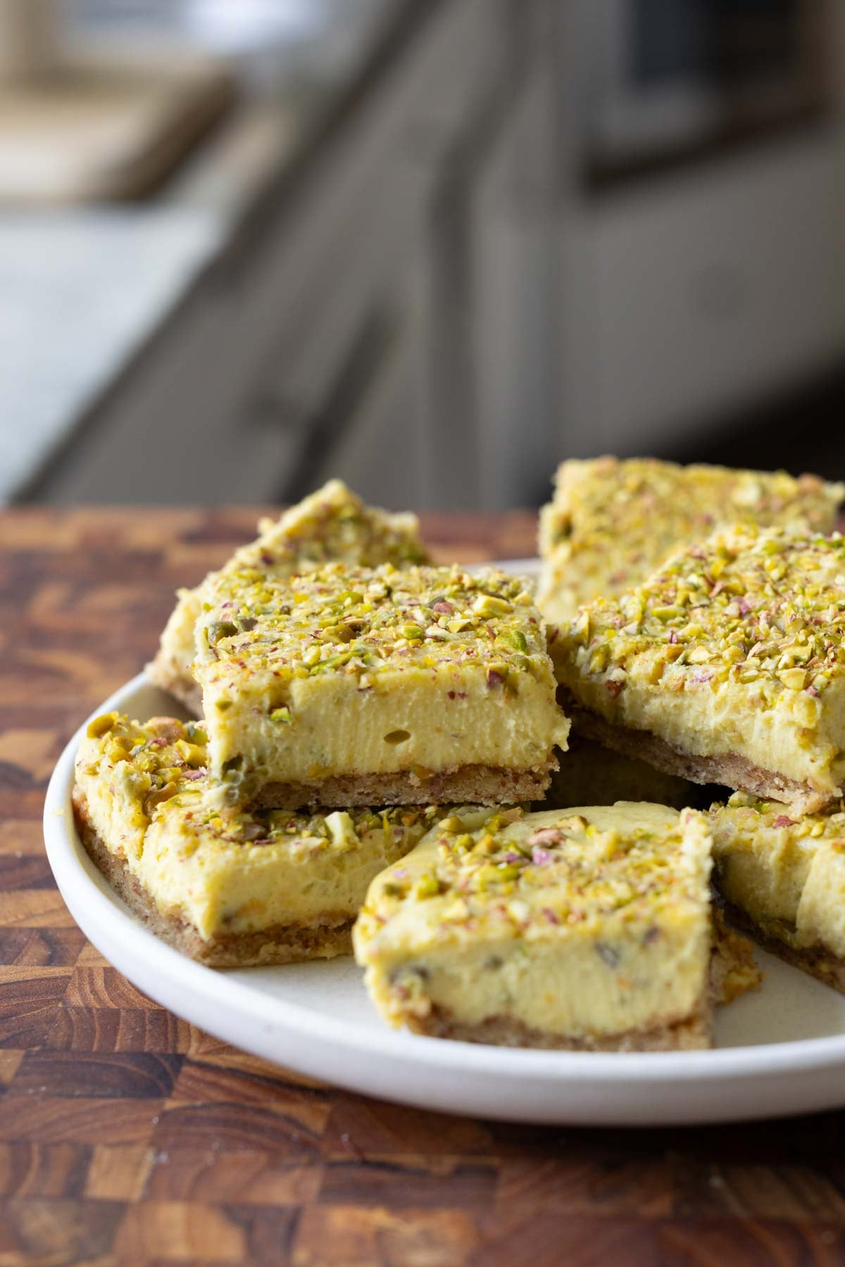 sliced saffron pistachio bars on a white plate