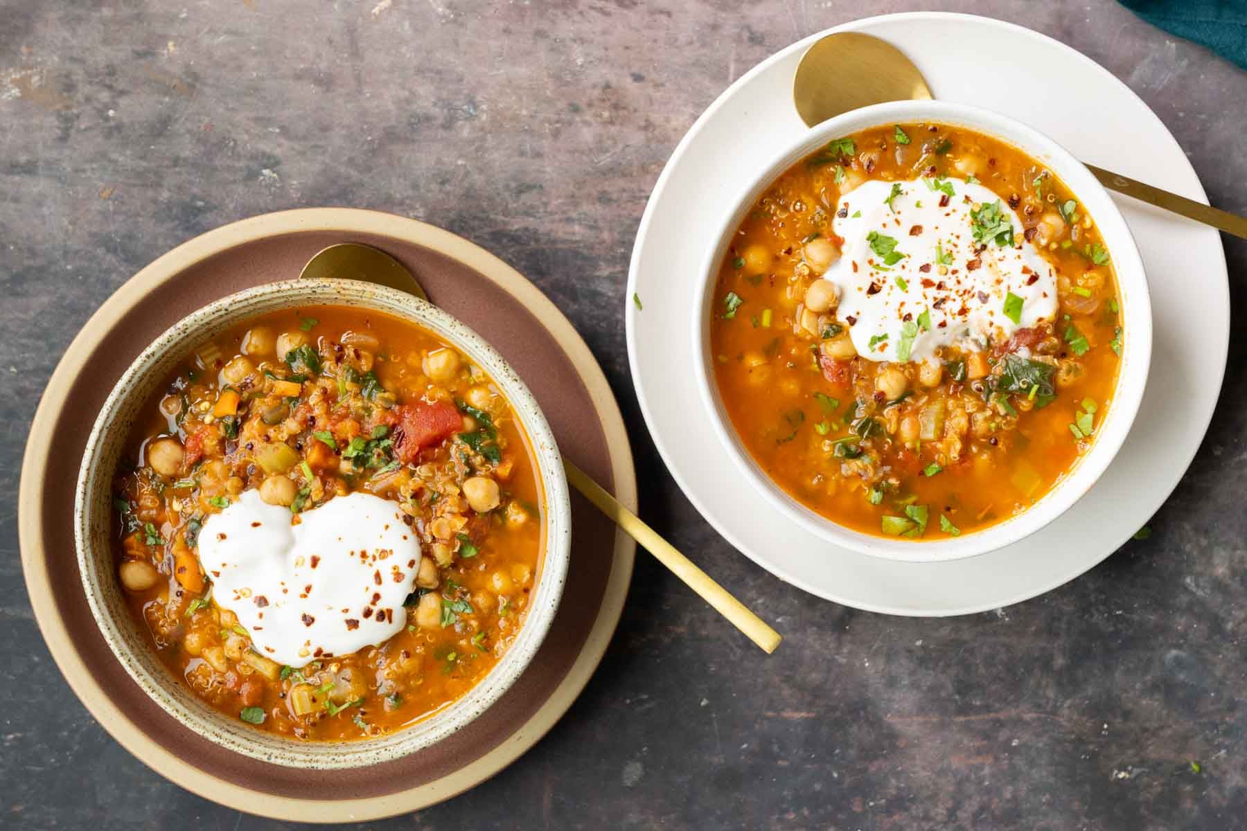 bowls of Moroccan harira garnished with yogurt and red pepper
