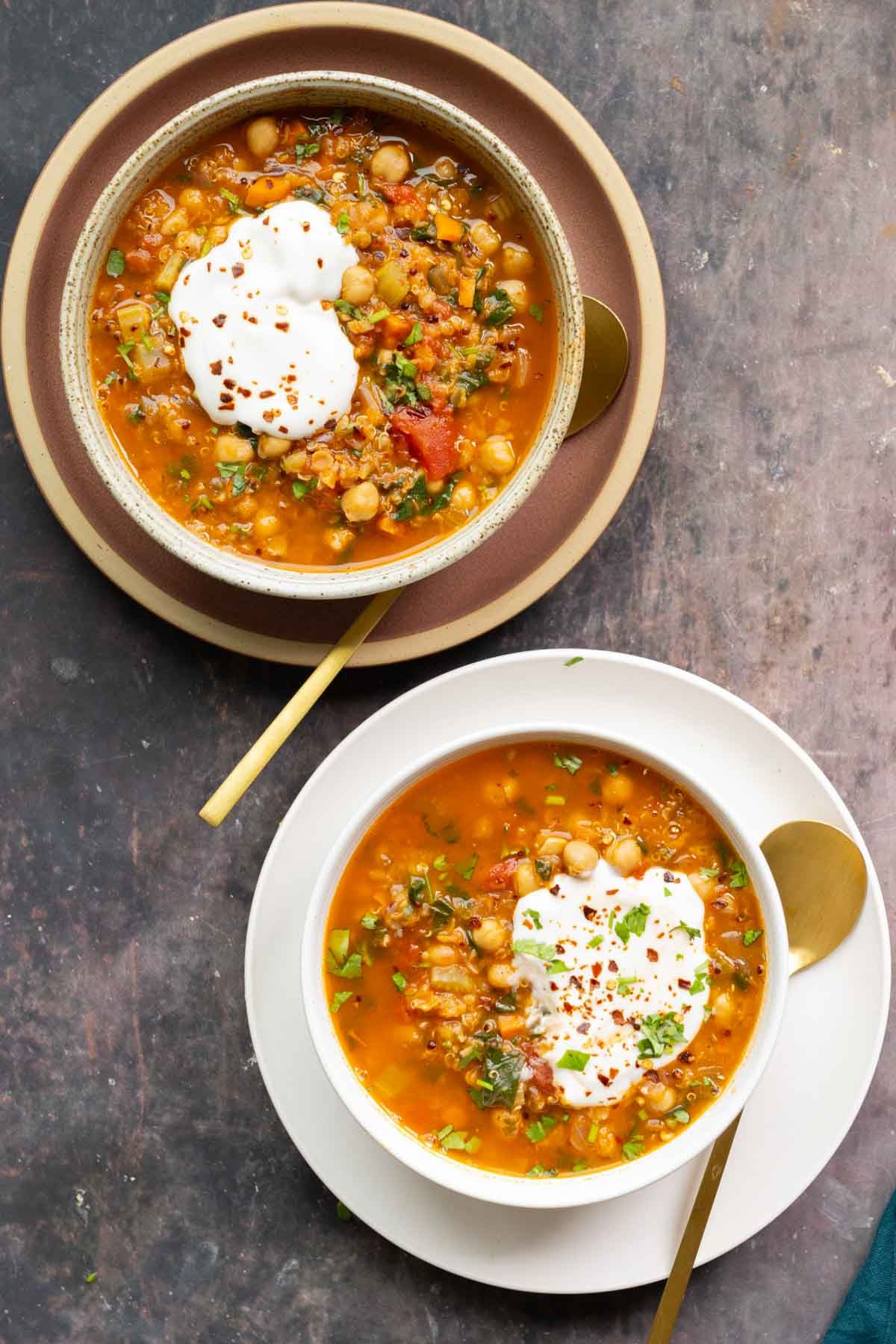 bowls of Moroccan harira garnished with yogurt and red pepper