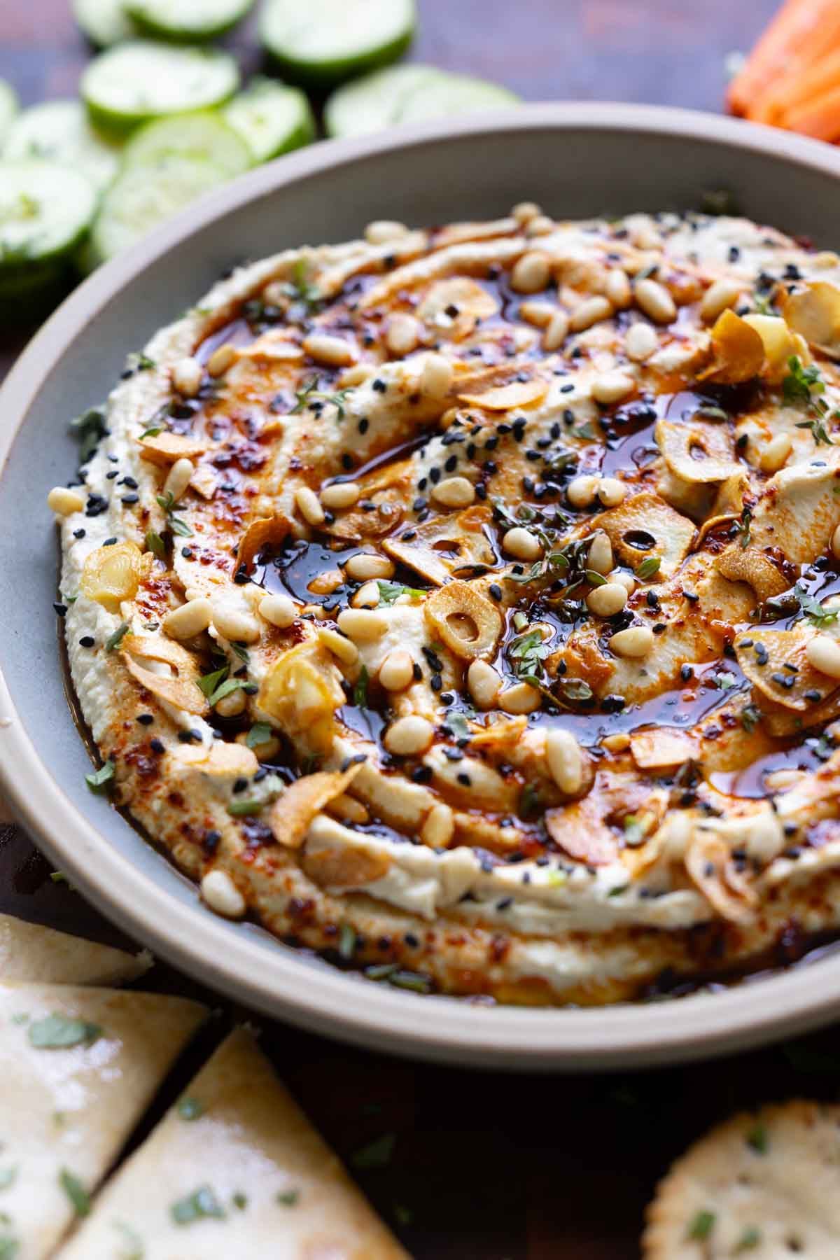 close-up of whipped feta topped with the hot honey and garlic and seeds