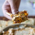 piece of pita scooping up a bite of the whipped feta